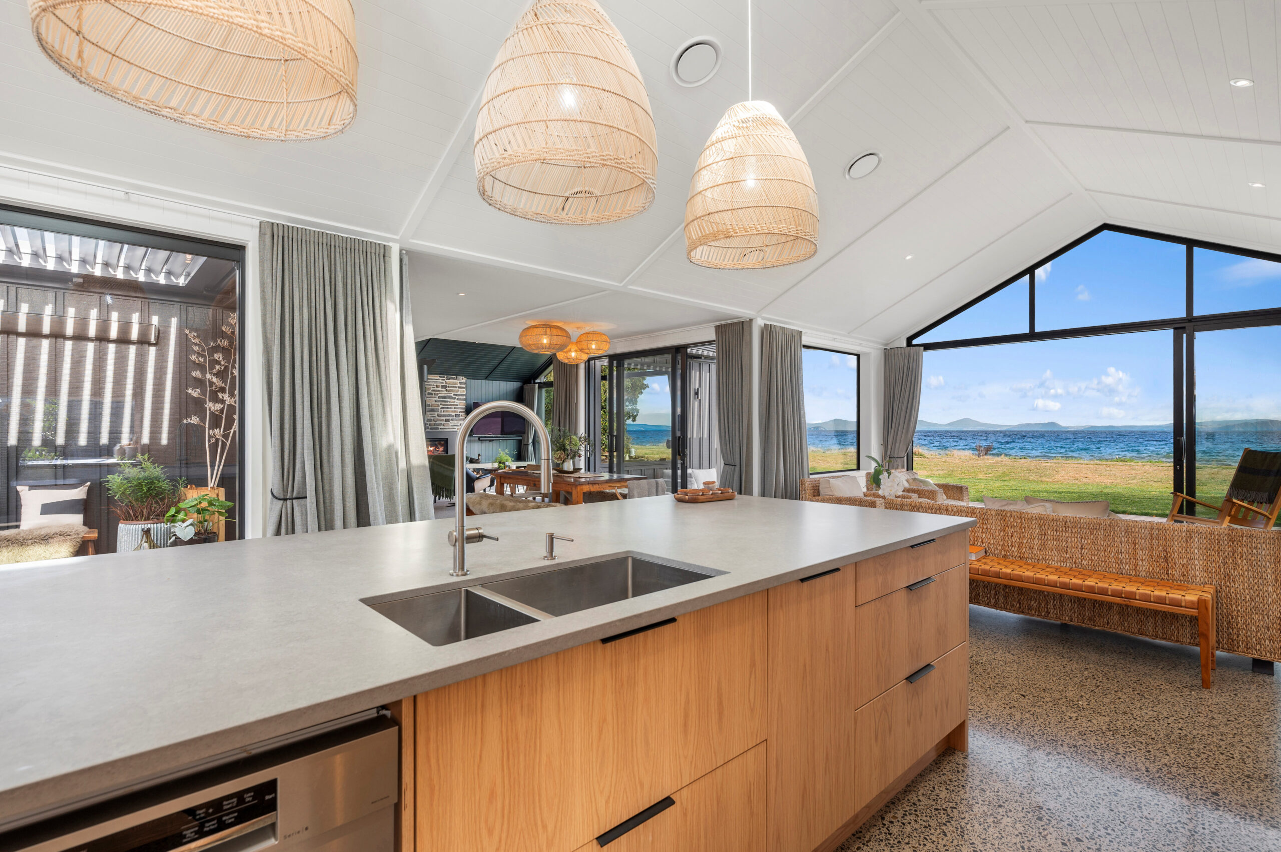 The Raking grooved ceilings with cover battens create a spacious and luxury feel to this lakefront home in Taupo