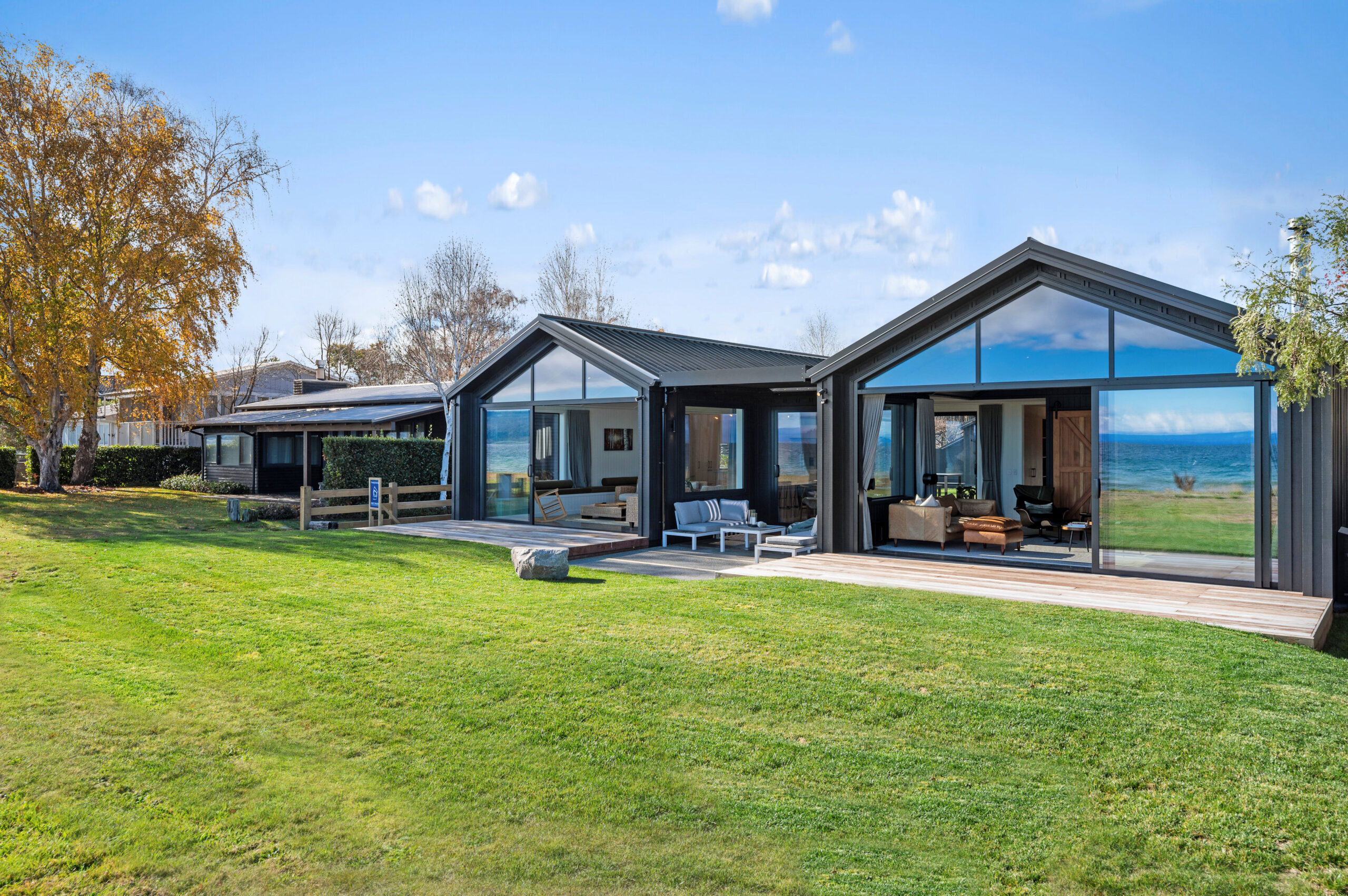 Lake Taupo reflecting off the windows on this award winning home constructed by Built Spaces